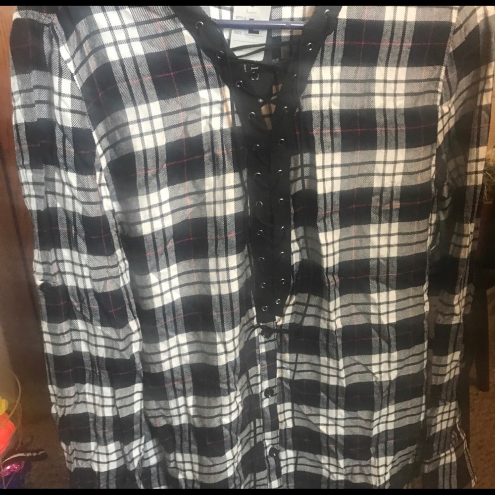 Lace up flannel shirt.